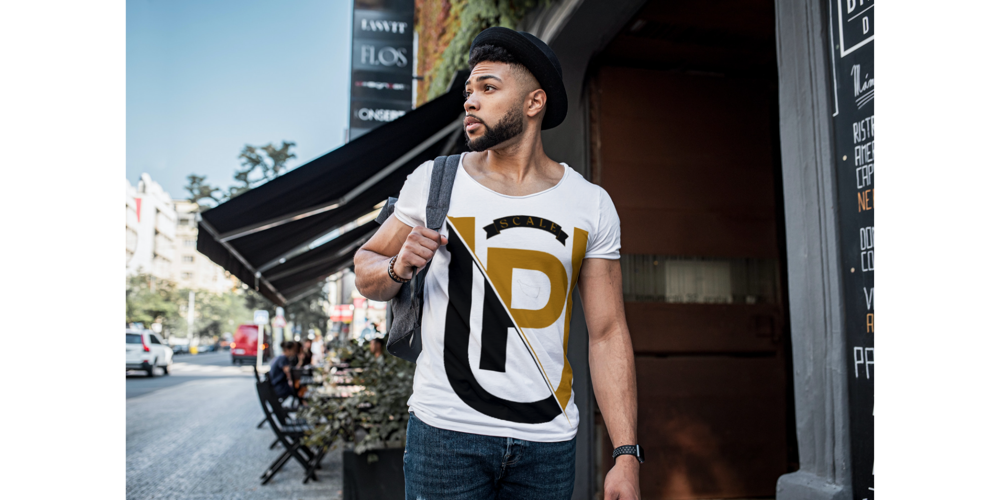 Young black male wearing white flavor's upscale t shirt with logo on front 